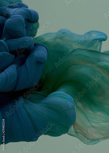 Abstract digital art piece that appears to be made up of different shades of blue and green. the blue is on the left side of the image, with the green on the right side.