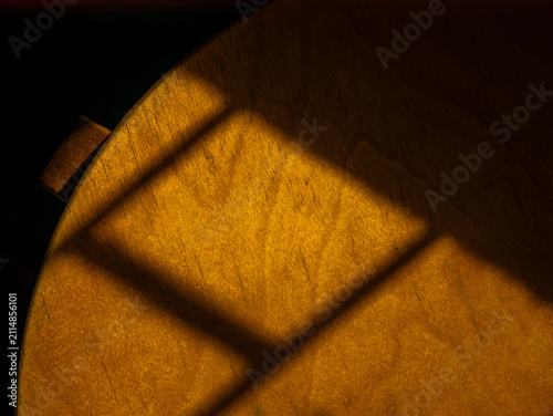 Golden Window Shadow Pattern on Wooden Surface, Warm Light and Shade Abstract Texture
