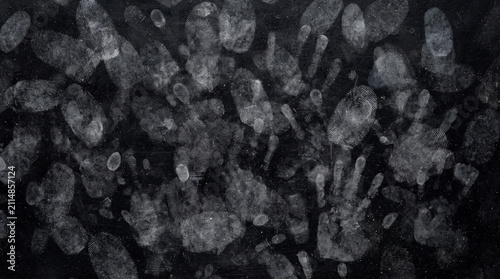 Creepy dark horror background featuring multiple ghost hands pressing against foggy glass