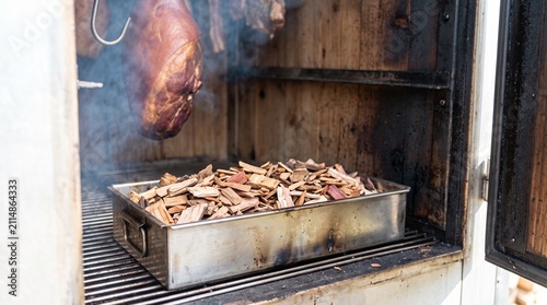 Ham smoking chamber with wood chips filled for smoking meat