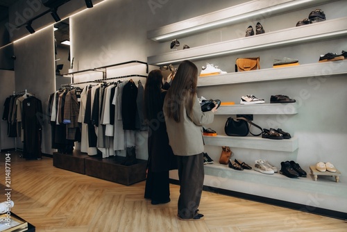 Women browsing modern fashion apparel and shoes