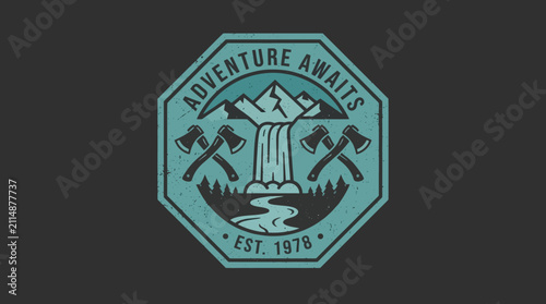 Adventure Awaits Emblem with Waterfall and Axes.