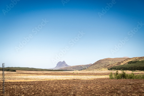 A sunny, summer HDR landscape image of Suilven from Ledmore Junction in Assynt, Sutherland, Scotland. 