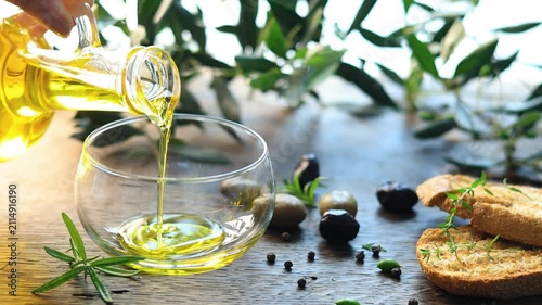 olive oil pouring in a glass bowl	
