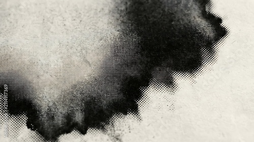 Abstract ink splatter texture with halftone dot pattern on textured paper background