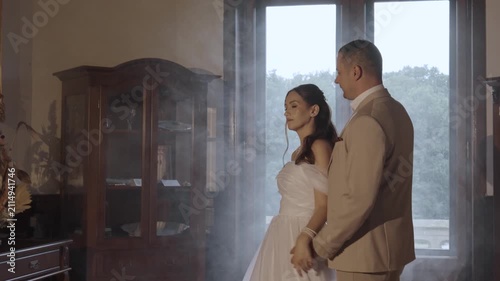 A couple in love, a man and a woman, hug and kiss.