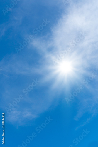 Hot sun in the blue sky, sunny weather and extreme temperature background