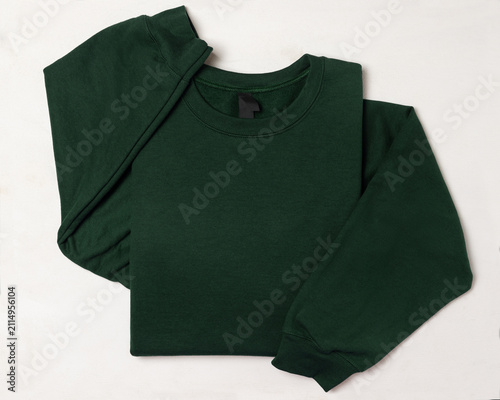 Obraz na płótnie Blank dark green unisex sweatshirt mockup, folded apparel template, copy space o