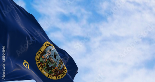 Close-up of the Idaho state flag waving in the wind on a clear day