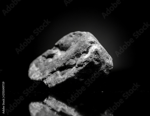 broken rock exposing bright quartz and metallic mineral veins with dramatic lighting and geological textures.