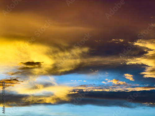 Captivating sky with broken clouds and a light breeze three minutes after sunset in July, possibly with Saharan dust, and with a small chance of showers, southwest Florida. Yin and yang in transition.