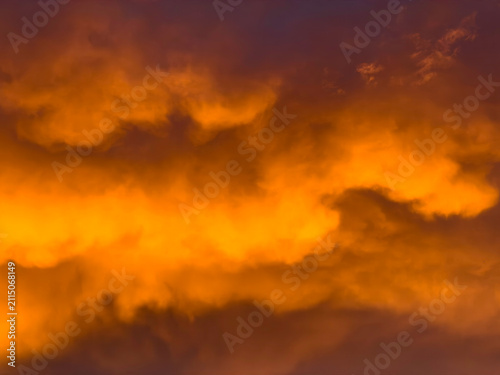 Summer clouds in the afterglow of sunset in southwest Florida during a widespread influx of dust from the Sahara Desert. Motifs of atmospheric conditions, cause and effect, air quality.