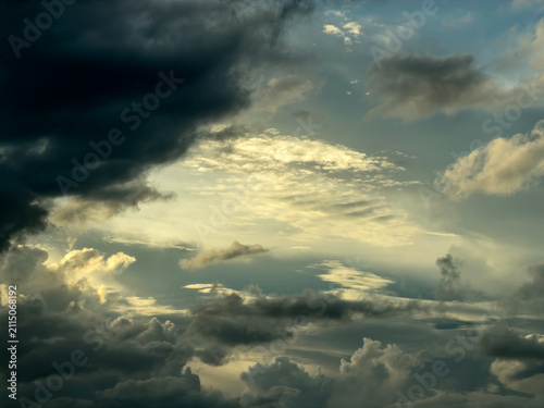 Clearing sky with light winds and erratic conditions after a thunderstorm on a summer evening in Florida. Motifs of chaotic systems and disquiet, complex dynamics in transition, yin and yang.