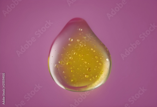 Golden oil drop with tiny b...