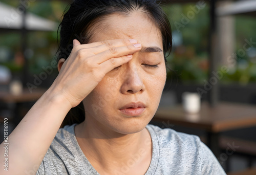 Young asian woman suffering...