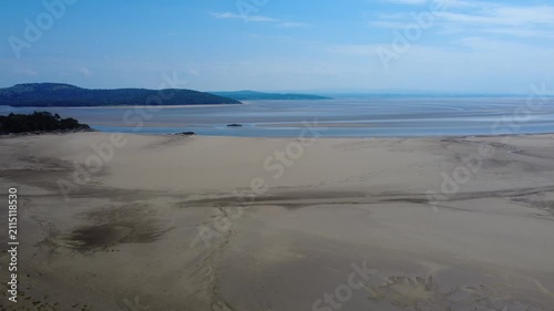 Aerial view of the beach at Grange over Sands showing the intertidal zone of the North side of Morecambe bay and the Arnside Knott on the other side of the river