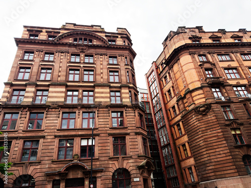 Картината върху платно Historic redbrick commercial buildings in Manchester, UK with ornate Victorian a