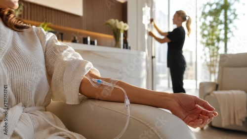 Woman receiving IV drip therapy in modern wellness clinic