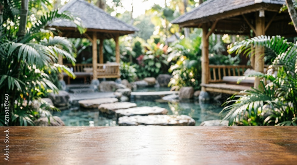 Fototapeta premium Tropical Garden with Wooden Table and Water Feature for Relaxation Concept