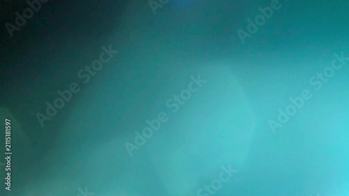 Glowing blue Lens Flare and Light Leak Overlay Animation Black Background 4K Stock