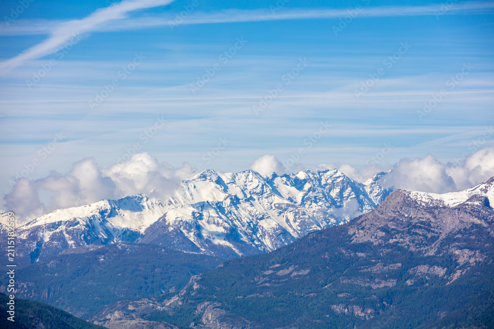 Fototapeta premium Mountain tops are covered with snow. Panorama of the mountains. Hautes-Alpes, Provence, France Provence Alpes Cote dAzur. 