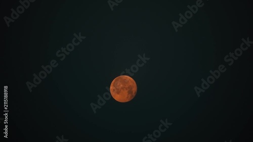 Orange Full Moon Glowing Against a Dark Night Sky With Copy Space