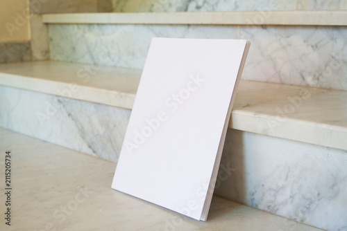 book mockup on marble stairs soft light
