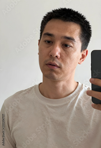 Young asian man taking a se...