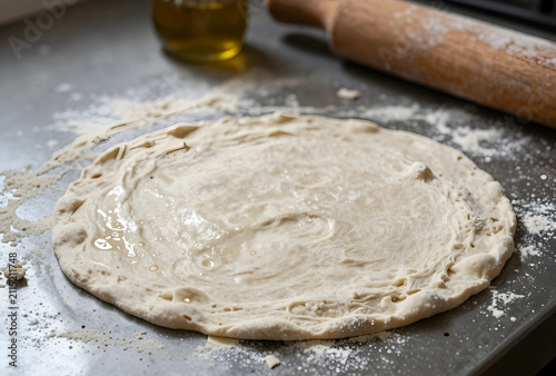 Freshly prepared pizza doug...