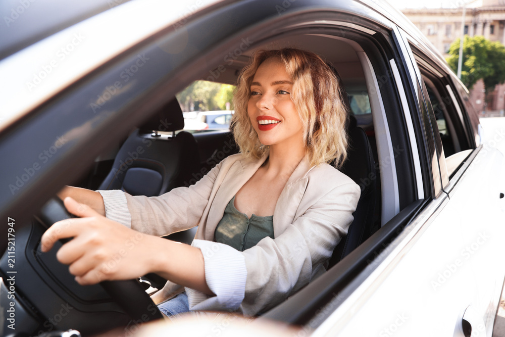 Obraz premium Woman driving modern car, view from outside