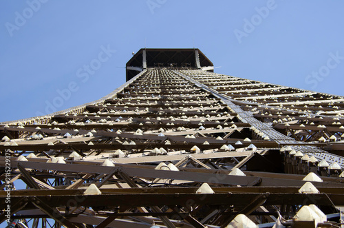 The metal structure of the Eiffel Tower is a landmark of 19th-century engineering. Paris, France