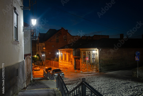 Evening street of Uzhhorod city in Ukraine, cityscape at blue hour