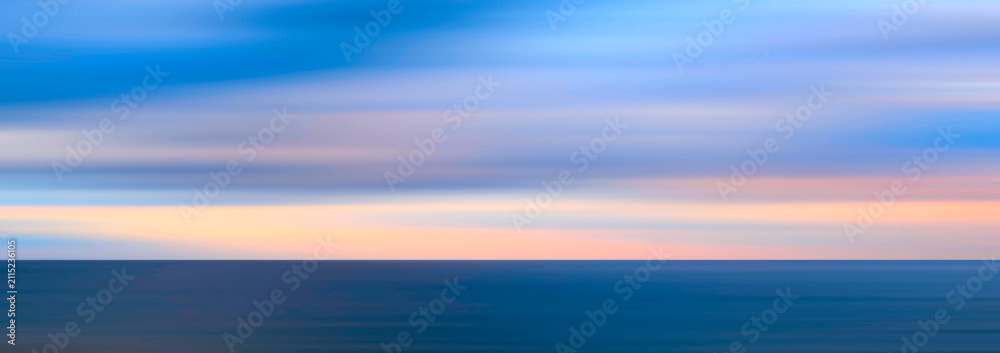 Obraz premium Delicate pastel pink meets a soft blue sky. Horizontal gradients transition into calming hues. Motion blur creates a peaceful atmosphere.