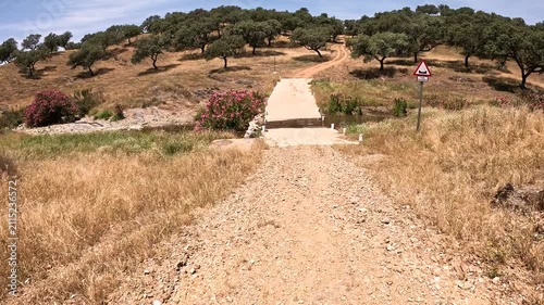 Via de la Plata - a rural path crossing a stream halfway between Almaden de la Plata and Real de la Jara, province of Seville, Andalusia, Spain