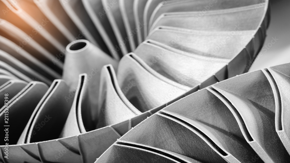 Fototapeta premium Close-up of 3D-printed metal turbine. machined surface reveals precise details. innovative additive technologies concept background