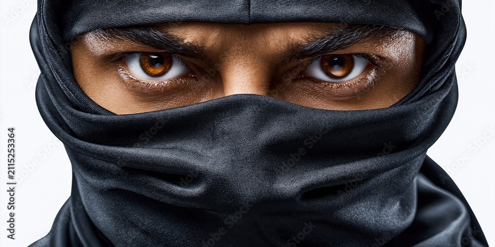 Naklejka premium Hidden identity intense eyes mysterious shadowed portrait