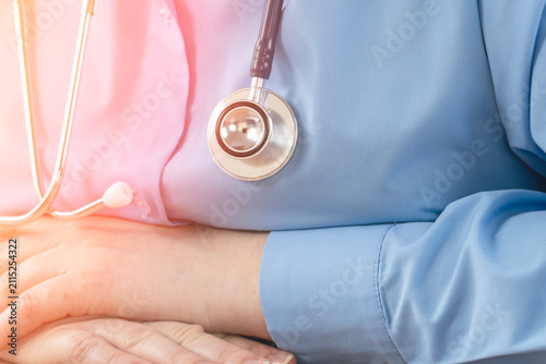 Canvastavla Blue medical uniform and stethoscope draped over chest