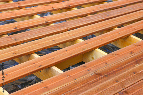 Unfinished wooden floor construction, half done construction surface