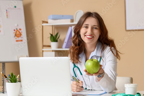 Smiling female nutritionist...