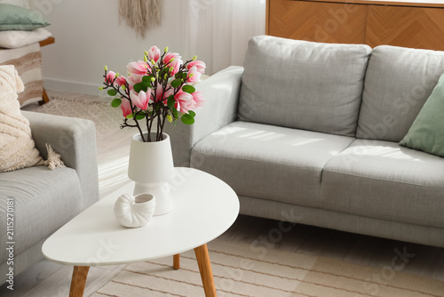 Vase with artificial magnol...