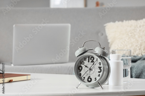 Alarm clock with pill bottl...
