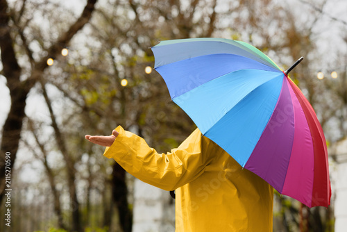 Woman in raincoat with rain...