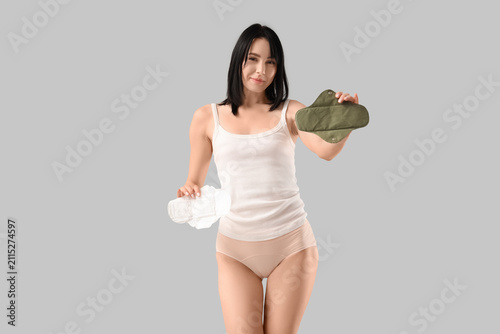 Young woman in beige menstr...