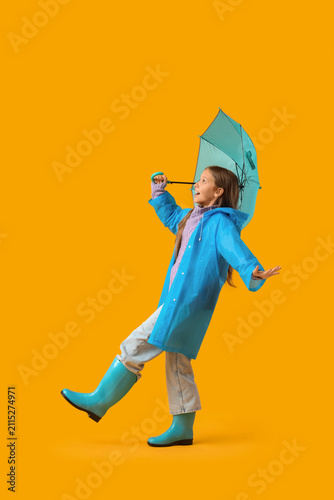 Cute teenage girl in rainco...