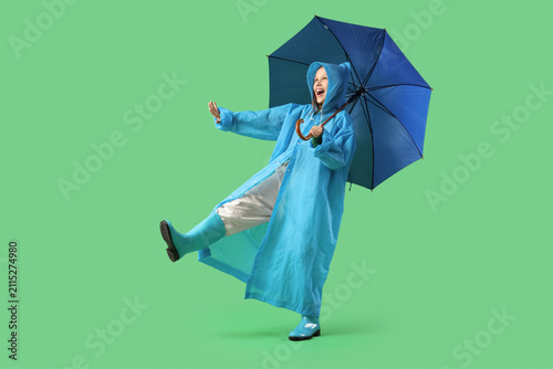 Cute teenage girl in rainco...