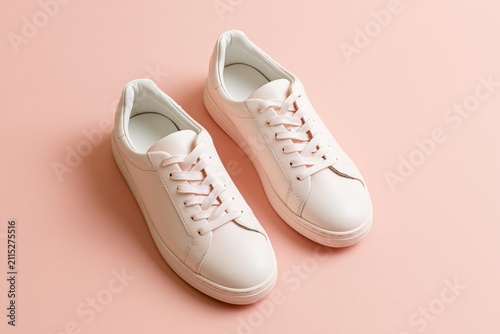 Premium leather sneakers on soft pastel background for product display