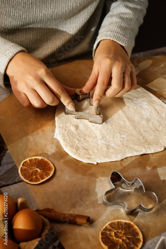 Woman cutting dough for swe...