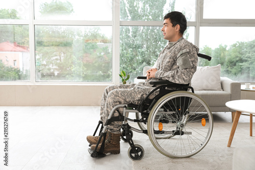 Young soldier in wheelchair...