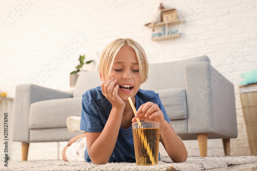 Little boy with glass of ju...