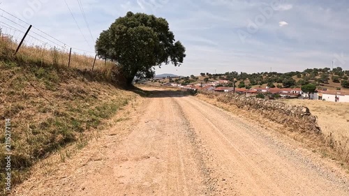  Via de la Plata - a gravel road entering El Real de la Jara, province of Seville, Andalusia, Spain